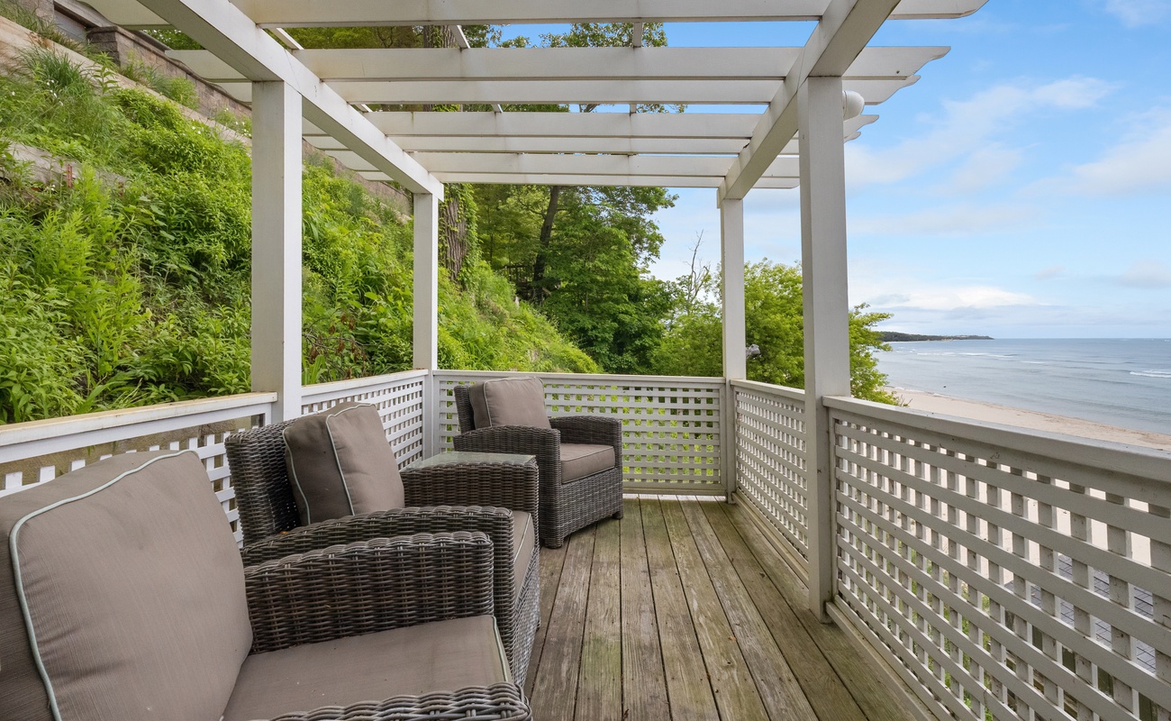 Relax beneath the pergola with ocean on the horizon.
