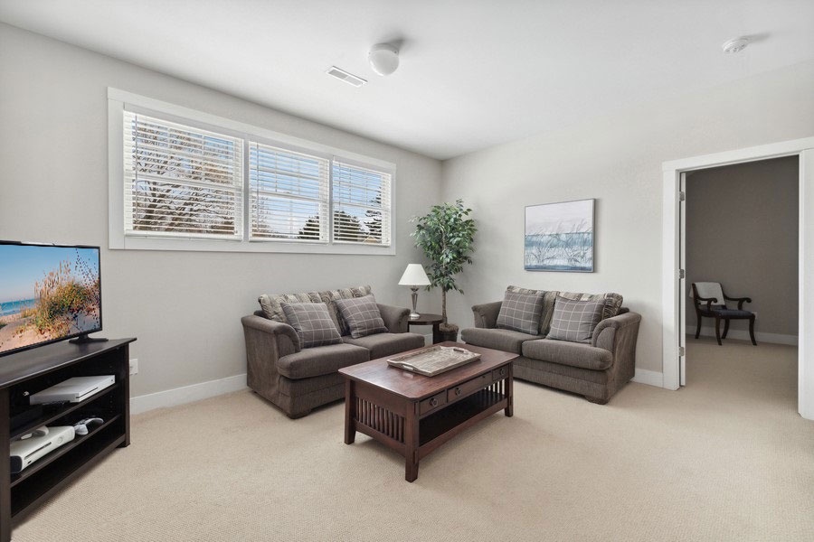 Unwind and enjoy a movie night after a fun-filled day in the cozy upstairs room.