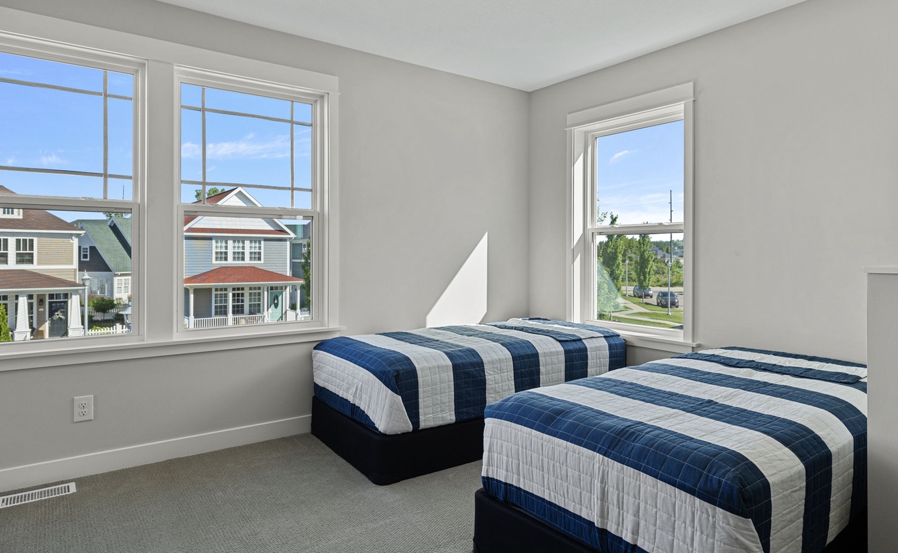 Additional 2 twin-size beds is on the upper floor behind the family room.