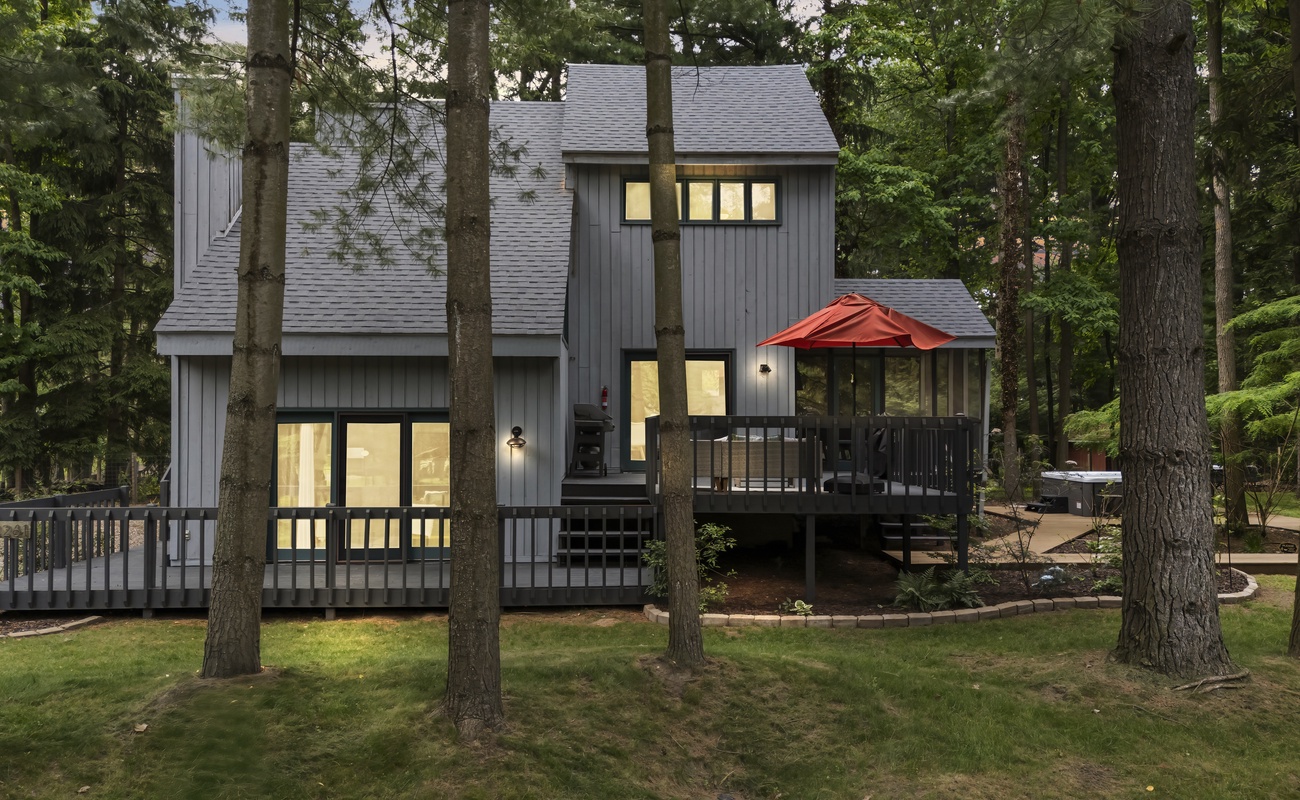Your private woodland retreat with decks, hot tub & firepit.