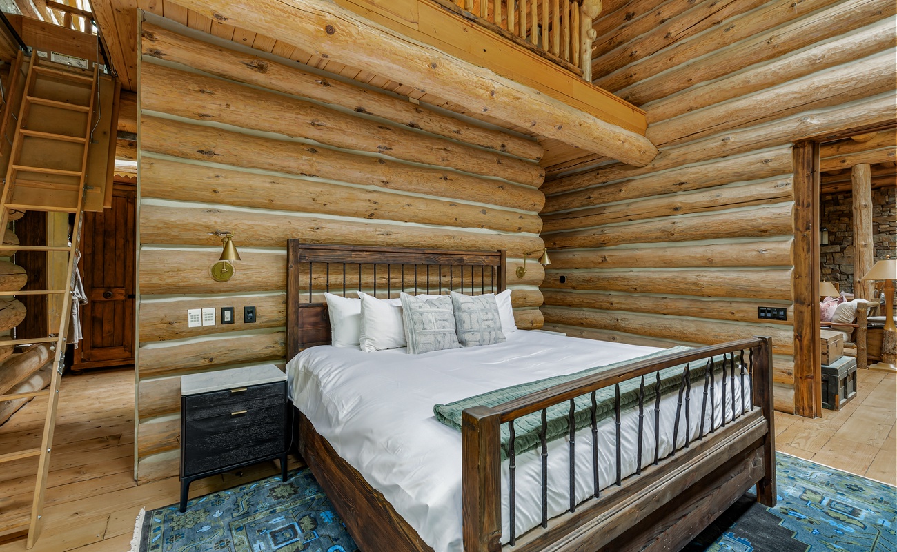 The primary bedroom is on the main level & has a king-sized bed.