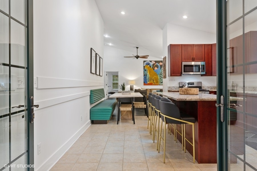 The spacious kitchen is highlighted by a large granite island.