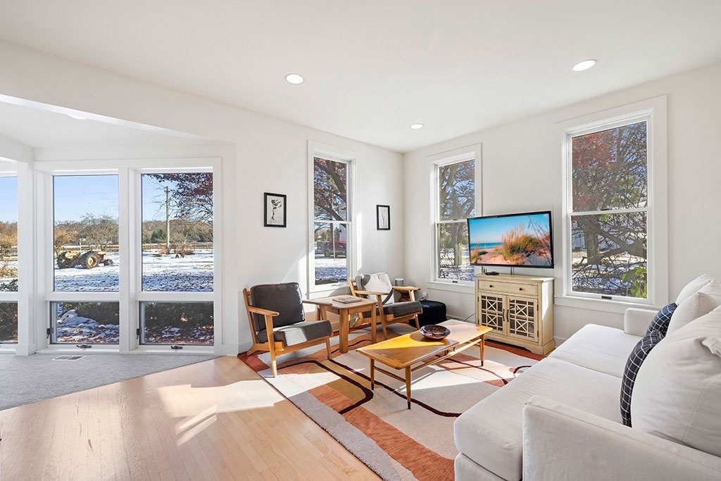 Easy lounging at The Farmhouse, framed by open farm views.