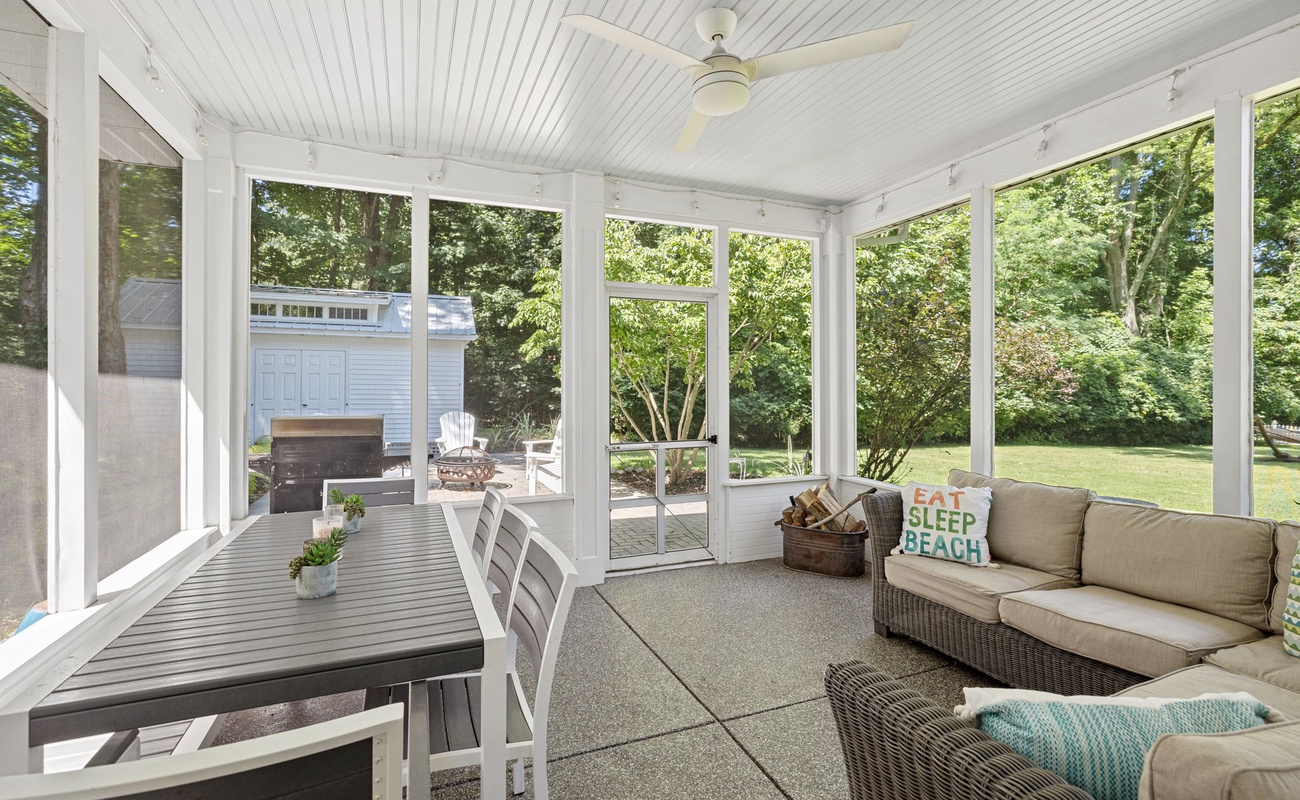 Dine, relax, and soak in the serenity—this porch is your year-round retreat.