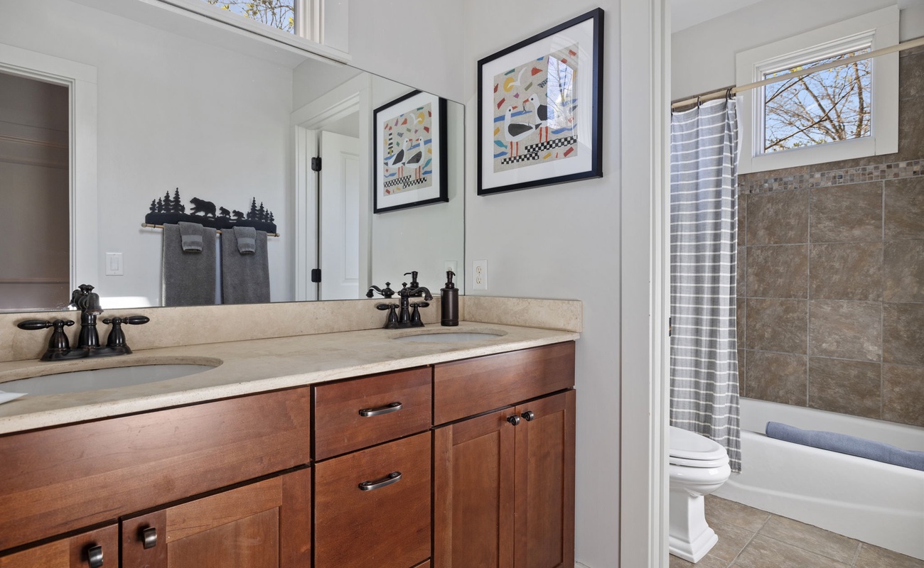 Having 2 twin-sink vanity bathrooms is wonderful during the morning rush.