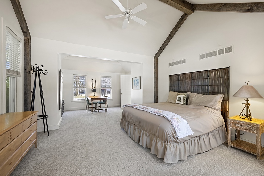The Farmhouse Primary Bedroom is on the main level and has a king-size bed.