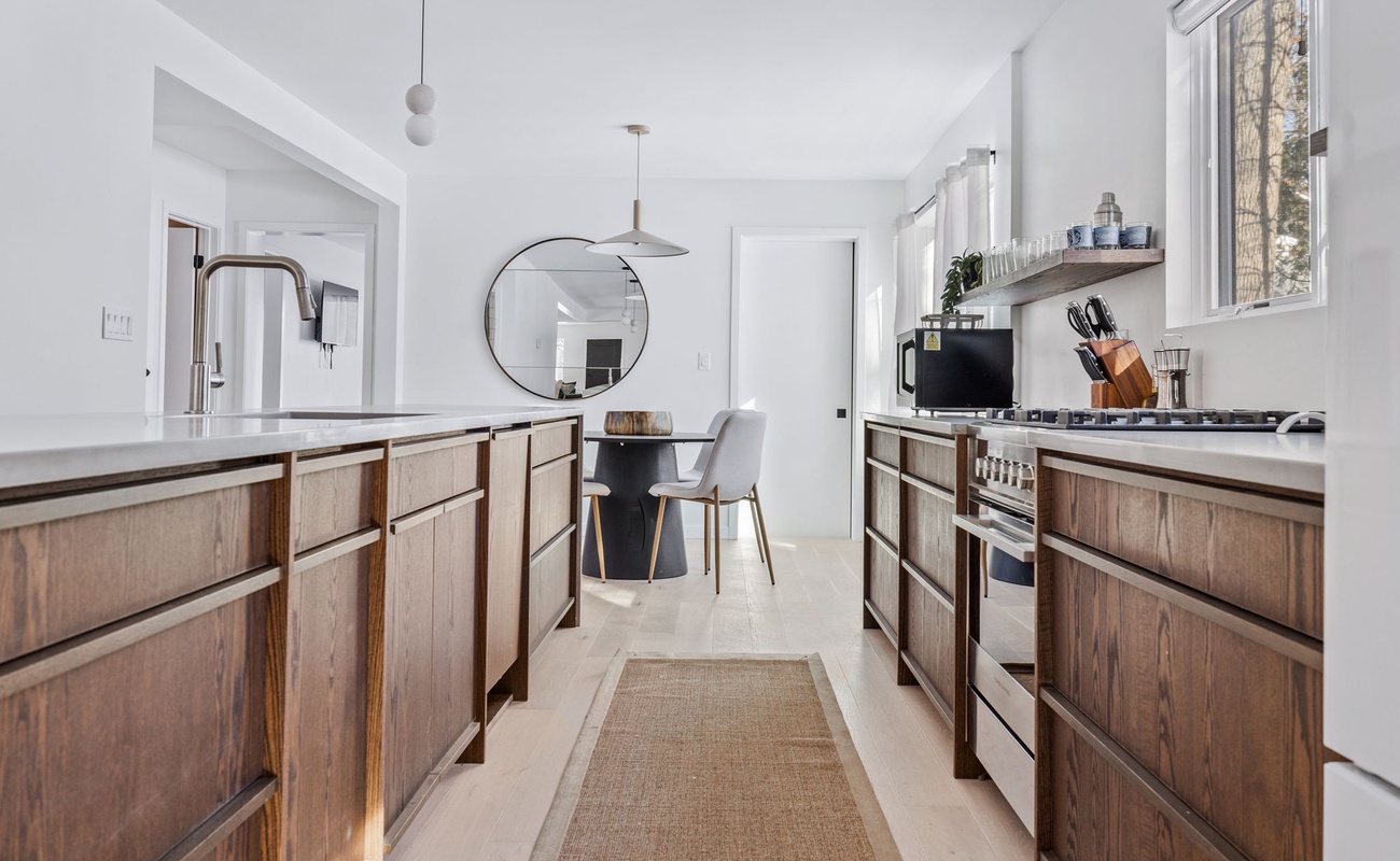 With warm wood tones, sleek finishes, and natural light, this kitchen is a recipe for perfection.