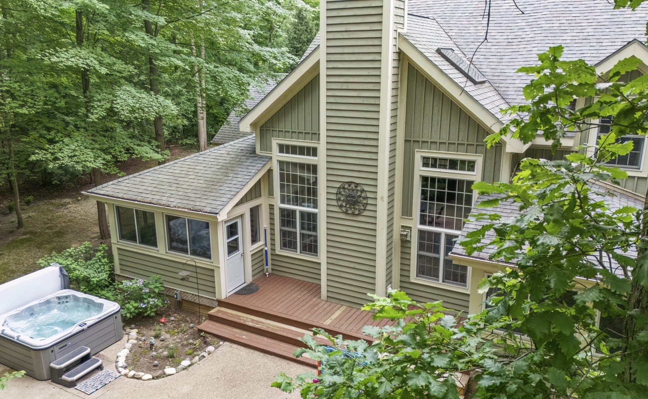 Surrounded by SW Michigan woods, this home's marvelous magic invites you in.