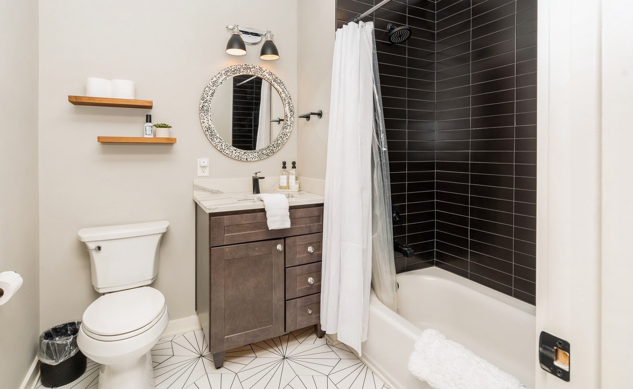 Soothing tones, bold tile, and a tub made for relaxing.