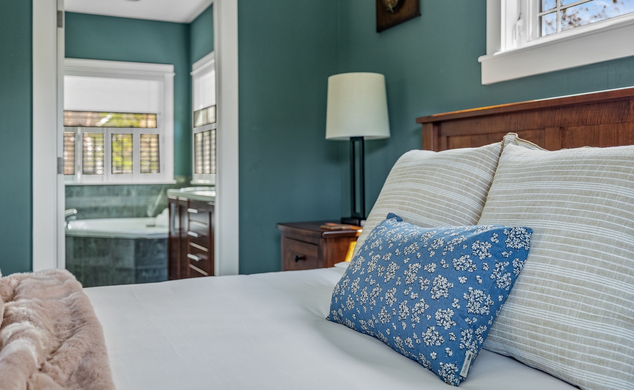 Soft sheets, bold walls, and a bathroom you don’t have to share—score!