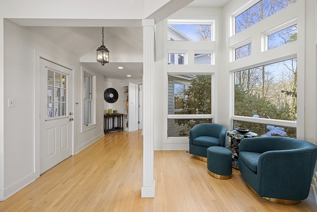 The Farmhouse entry opens into a warm, light-filled corner for relaxing.