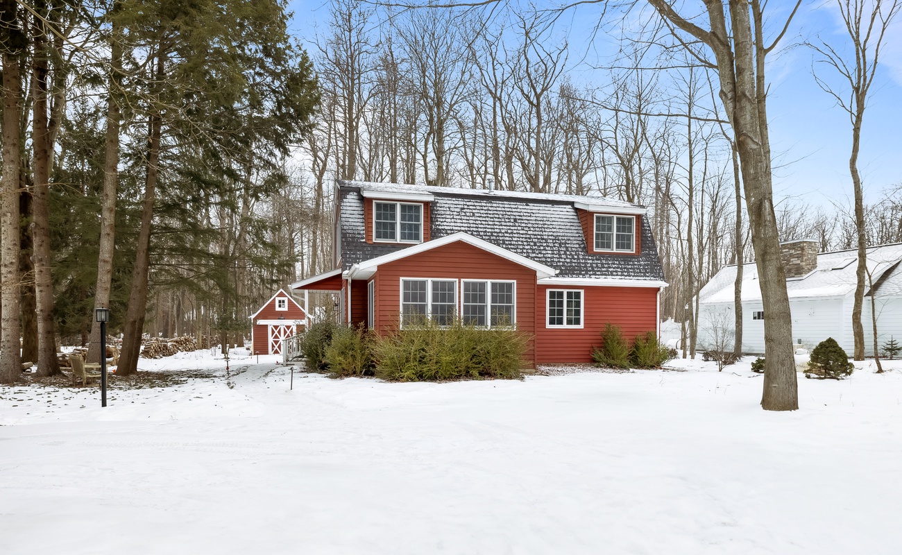 Your cozy escape, framed by snowy trees and nature.
