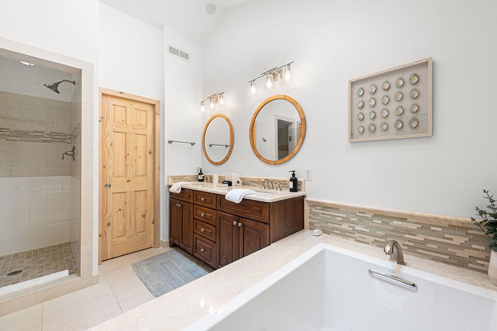 Double vanities, rainfall showers, and serious serenity.