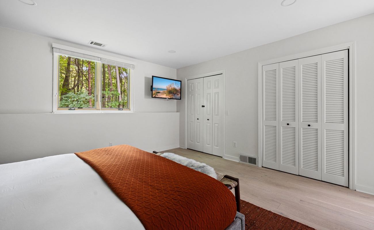 The main BR is spacious & has a Smart TV.