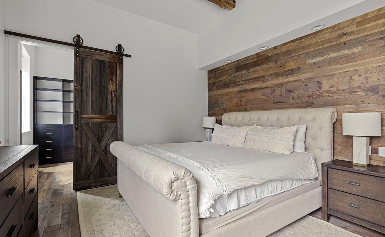 Primary bedroom is on the main level & has a king-size bed.