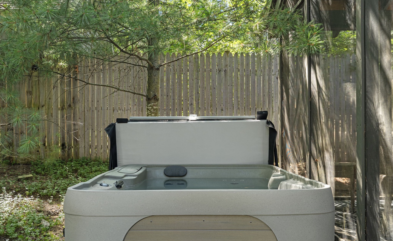 Step into serenity—your secluded hot tub sanctuary awaits, surrounded by nature's embrace. Perfect for melting away the stress of the day.
