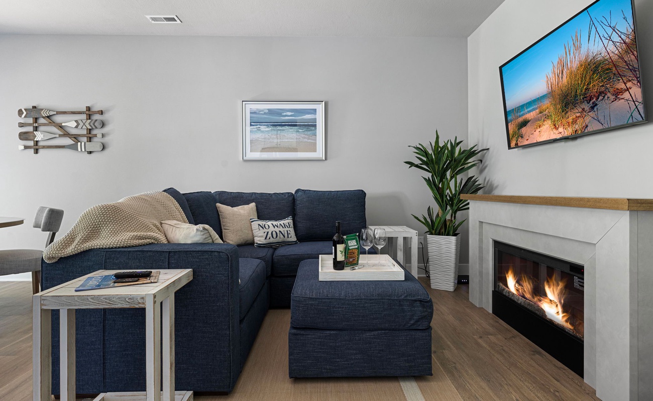 Cozy evenings are made of this: comfy couch, roaring fire, and a 'No Wake Zone' pillow to remind us that relaxation is a must!