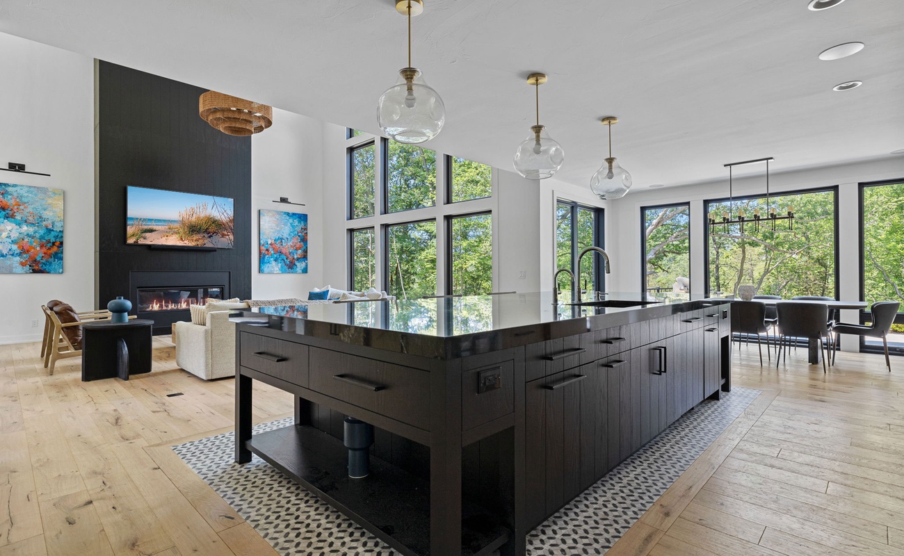 This stunning open kitchen is the ultimate gathering spot, featuring a spacious layout and a magnificent island that's perfect for entertaining.