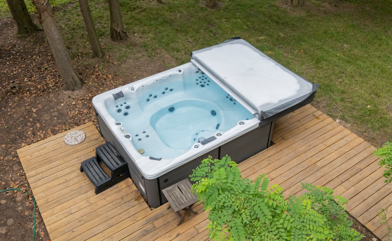 Let the jets melt your stress in a forest-framed spa.