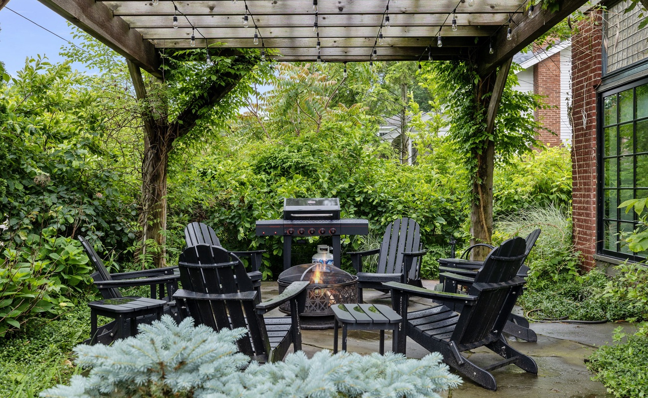 The fire pit & propane BBQ grill are directly off the kitchen for ease of serving and entertaining.