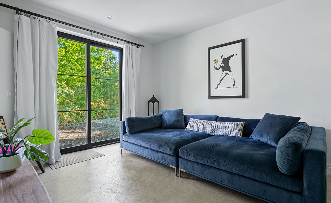 Bold sofa, bold art, endless comfort. Time to sink into relaxation.