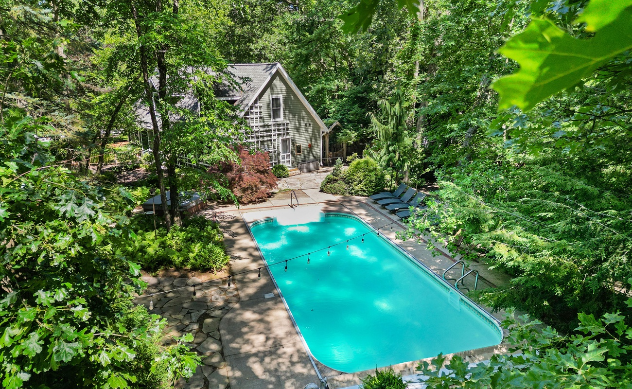 Welcome to Oasis in the Woods—your secluded spa + pool escape.
