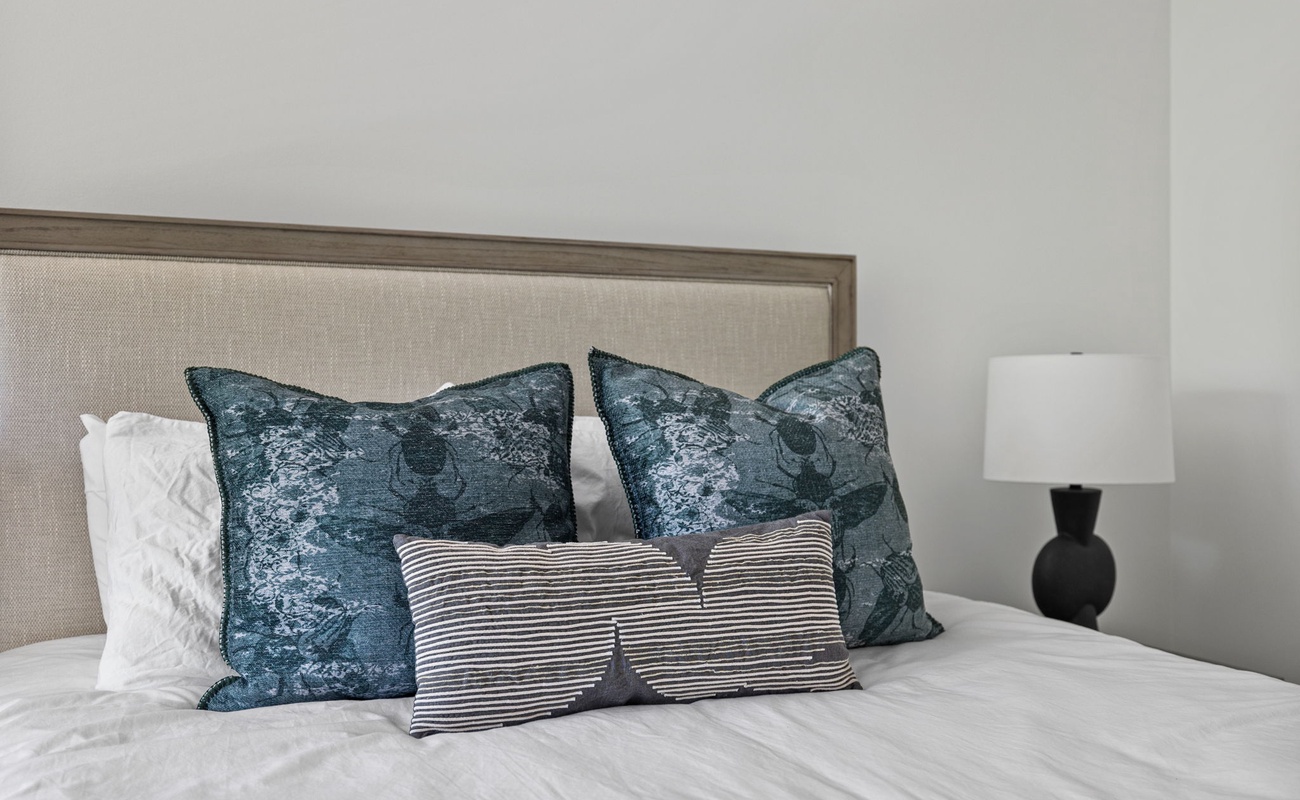 Sweet dreams are made of cozy beds, fluffy pillows, and a nightstand for all your bedtime essentials.