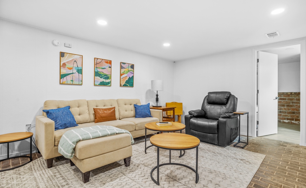 Kick back and relax in this chic living space—perfect for movie nights or lazy mornings.