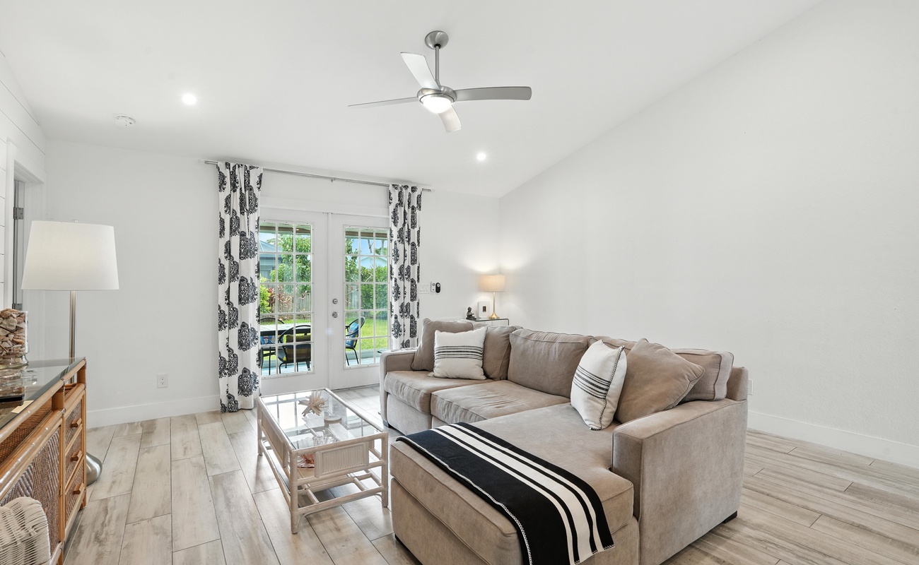 Chic lounging meets bright, breezy backyard views.