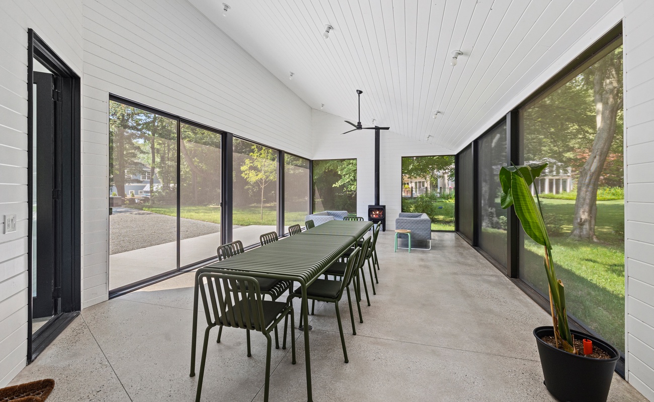 Transition to the screened porch for additional outdoor living space.