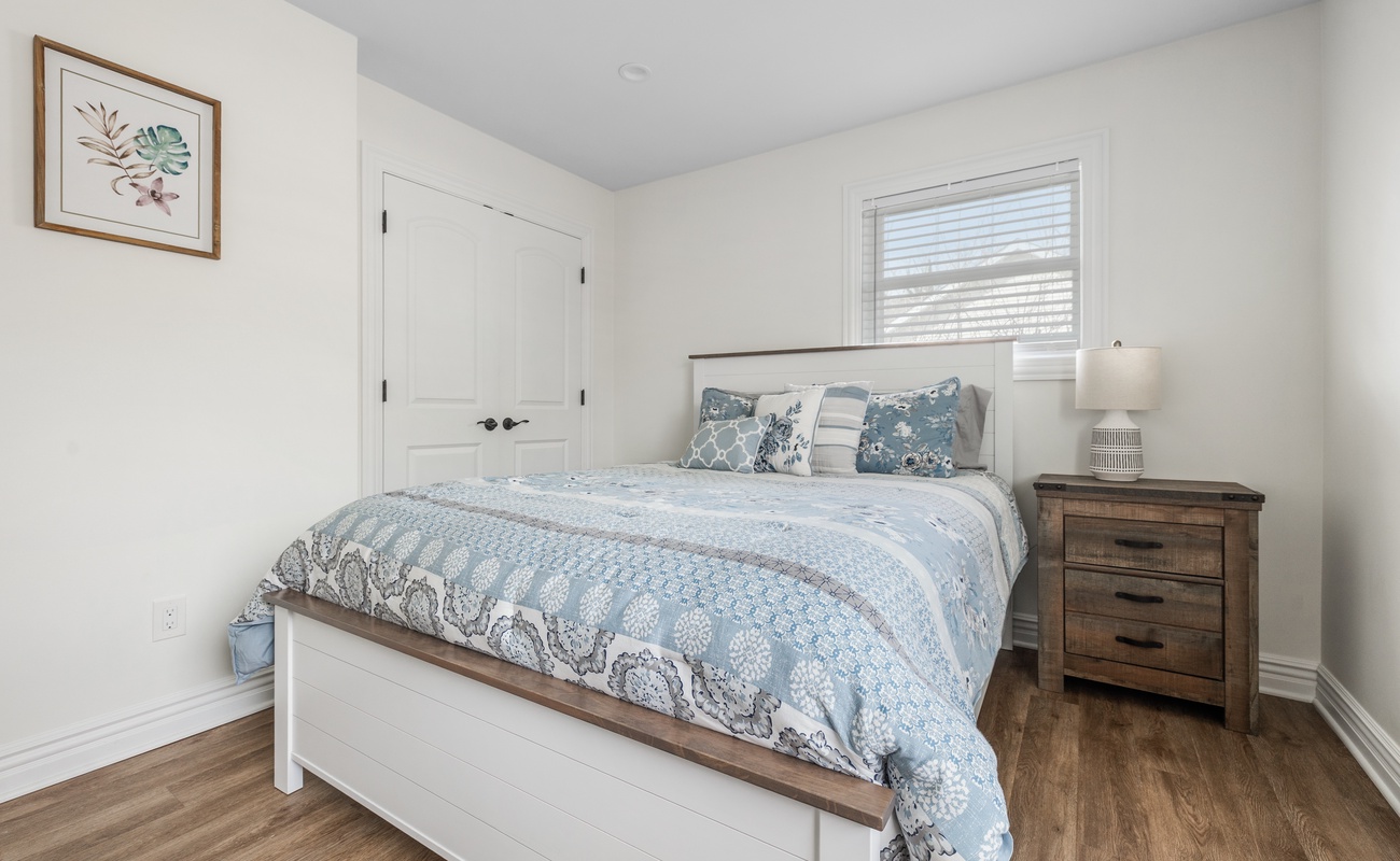 The primary bedroom is on the main level & has a queen sized bed.