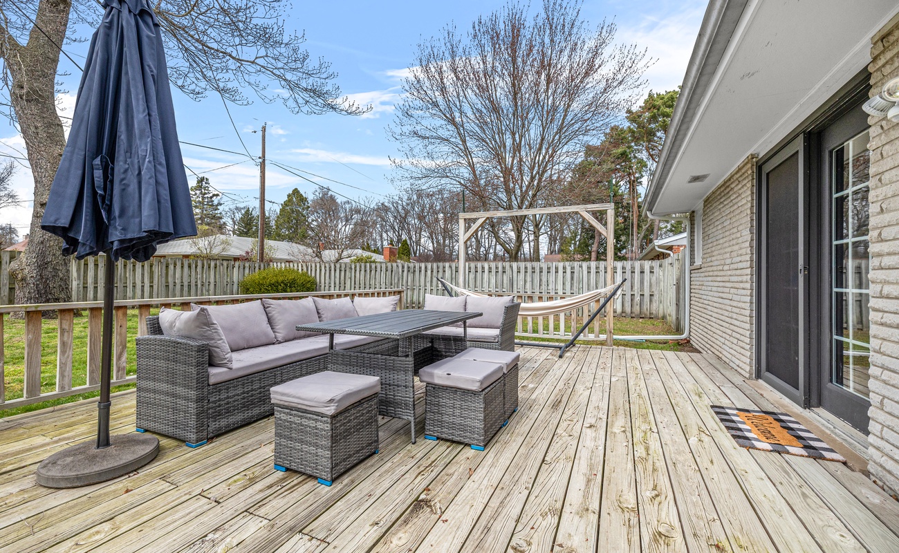 Chill, dine, and unwind on this spacious deck with comfy seating and hammock vibes—your getaway starts here.
