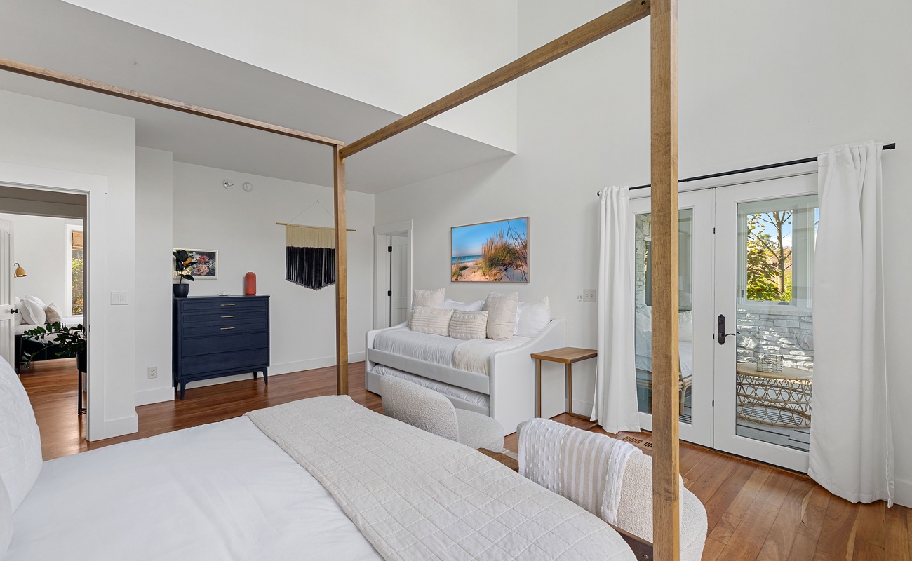 Primary bedroom is on the main level & has king-size bed and 2 twin-size b