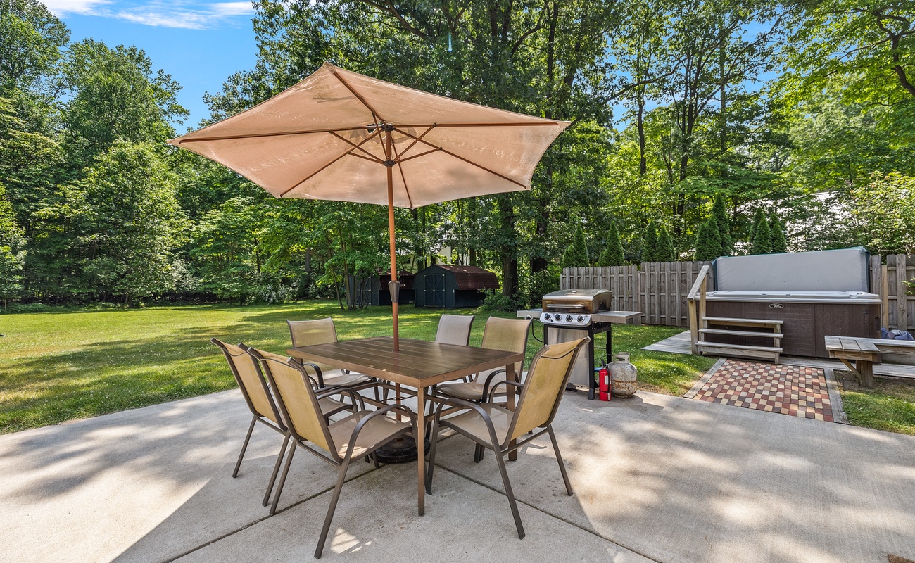 The backyard is perfect for entertaining with a pool, outdoor shower and bathroom, dining area, BBQ grill, huge lawn & fire pit.