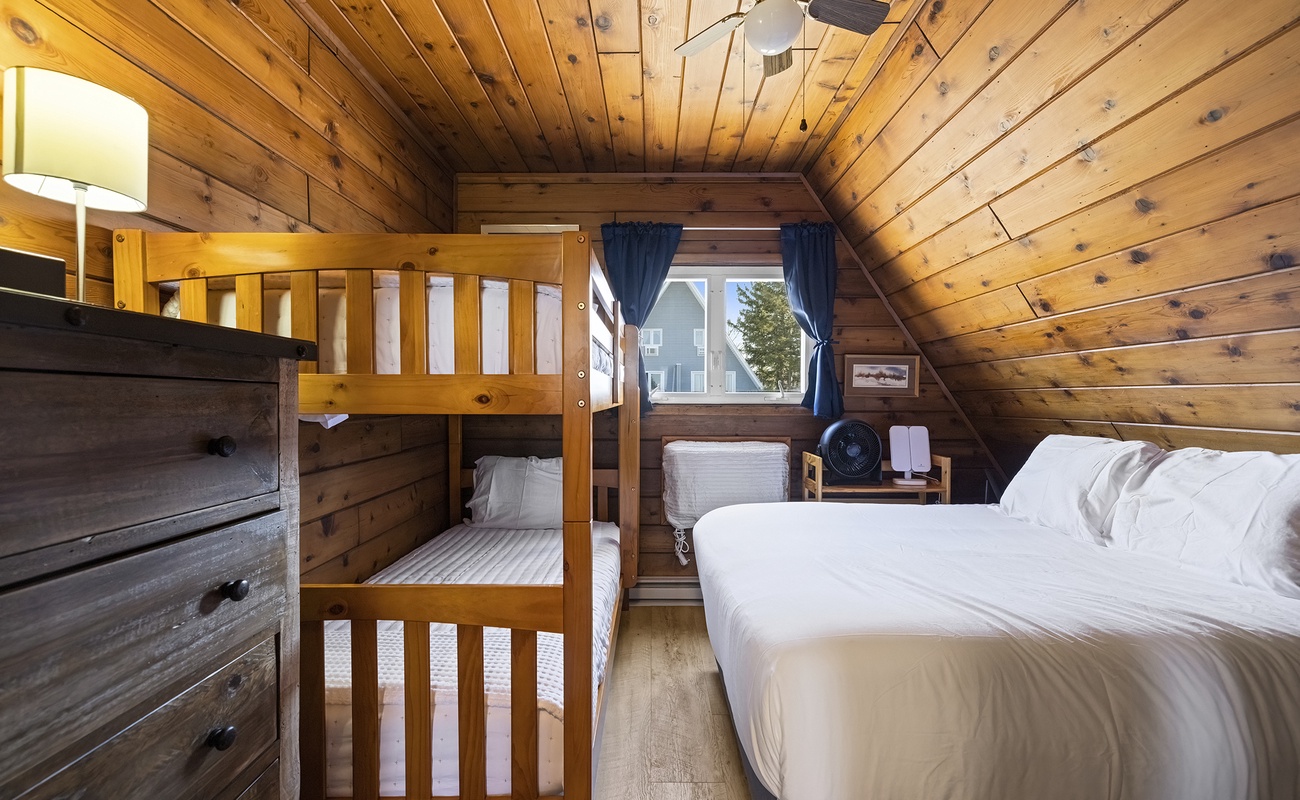 Bedroom 1 is on the upper level and has a queen-size + a single bunkbed.