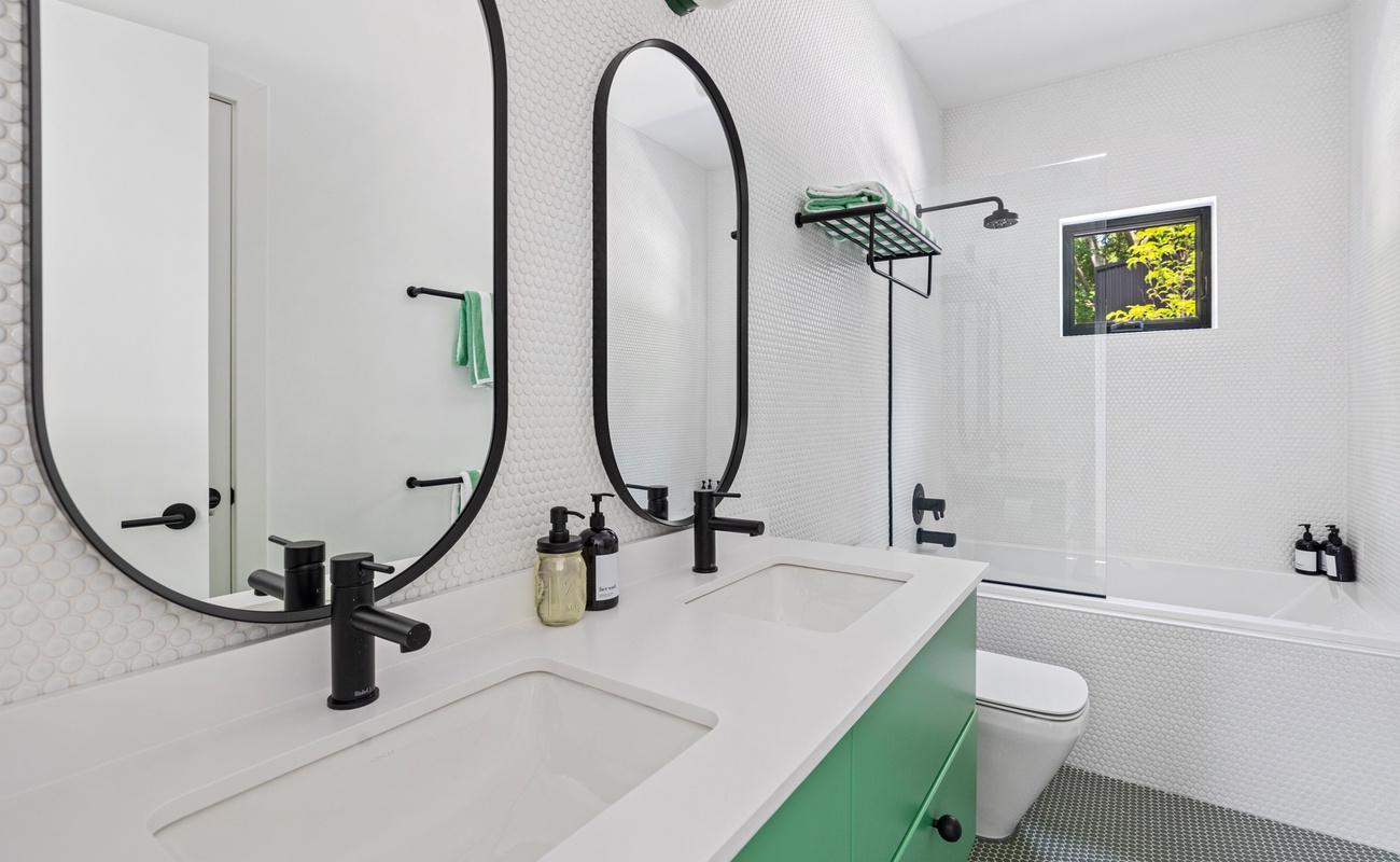 Custom fixtures and tilework add an exquisite flair to all 4 bathrooms.