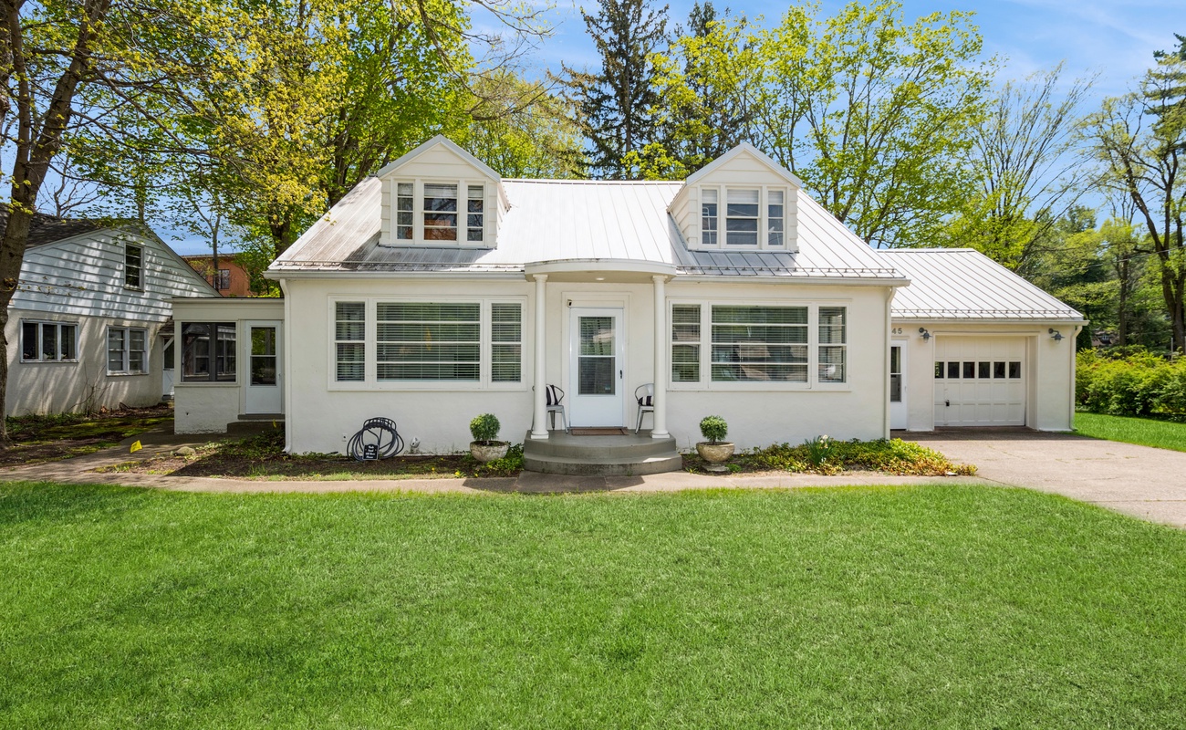 Sunshine, shutters, and the cutest porch for morning coffee.