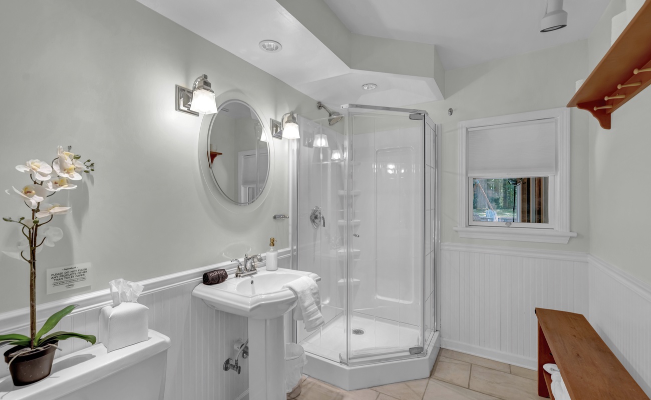 A spa-fresh bathroom with light, style, and a walk-in shower.