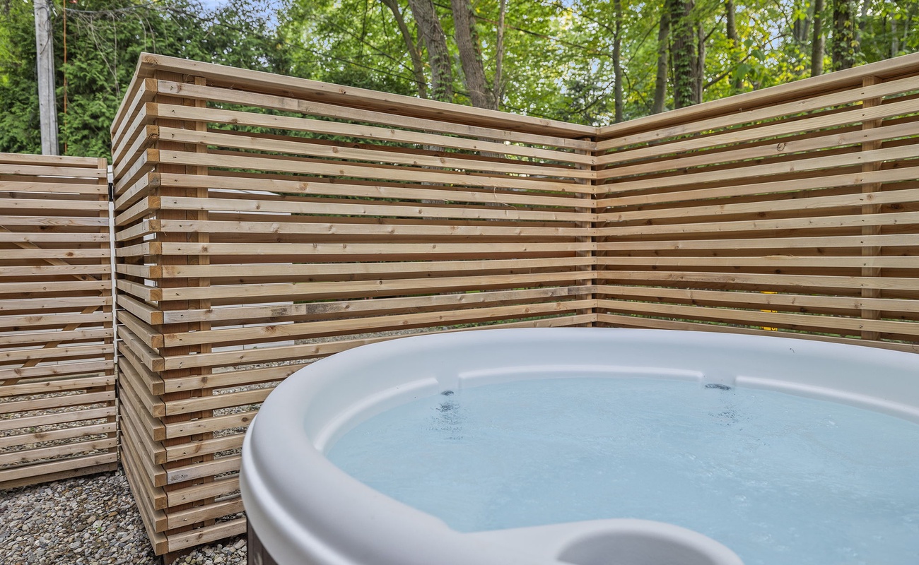 Surrounded by nature, soaking in the warmth of this wooden hot tub is pure bliss.
