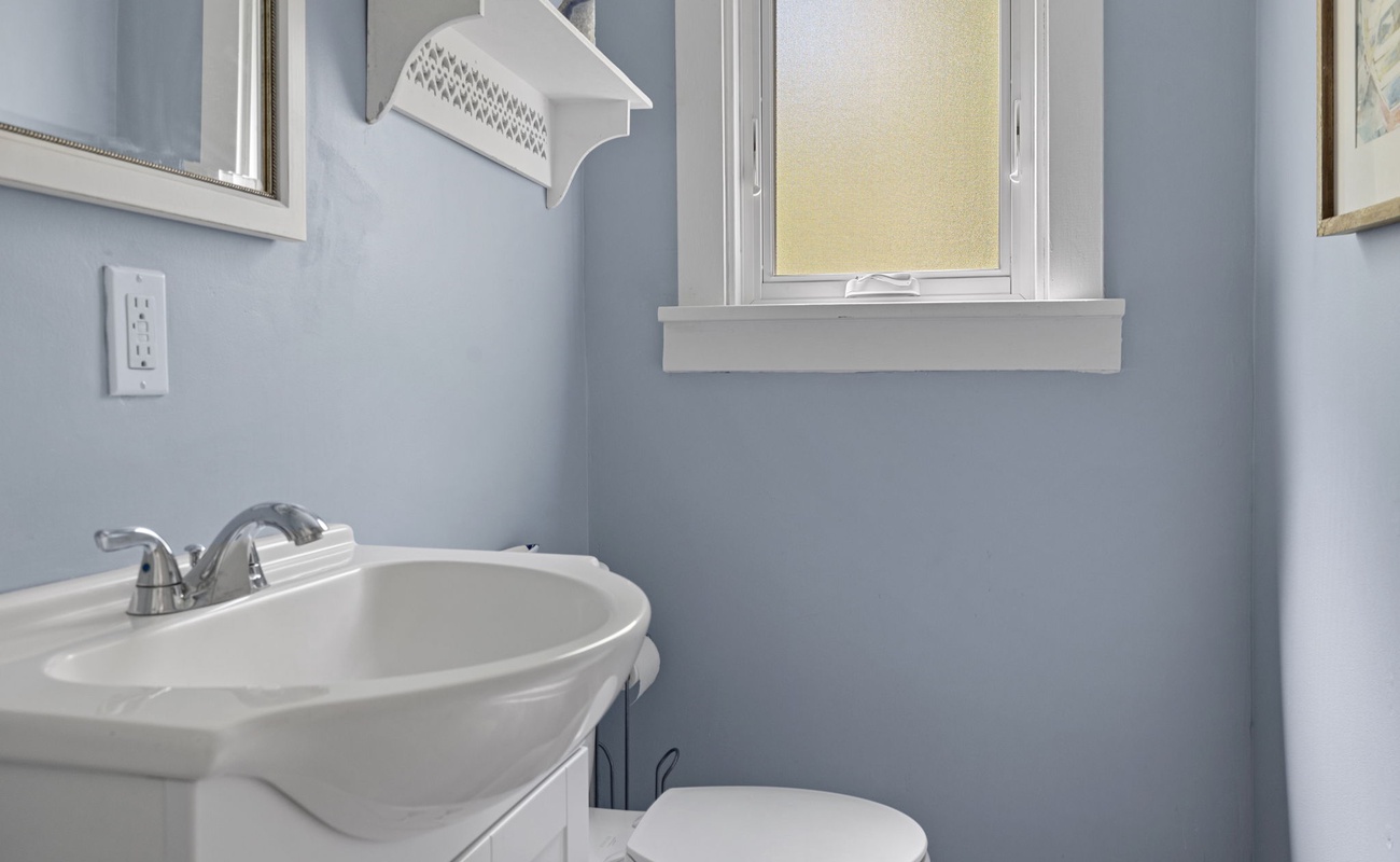 A splash of calm in the house—this cozy bathroom keeps it simple and sweet.