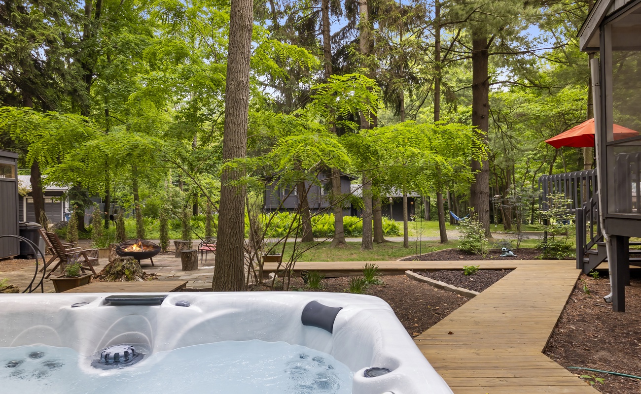 Path to paradise: firepit chats and steamy soaks await.