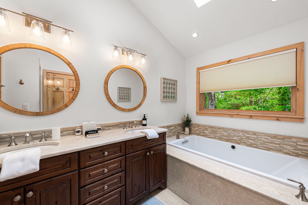 A tub with a view and a vanity built for two.