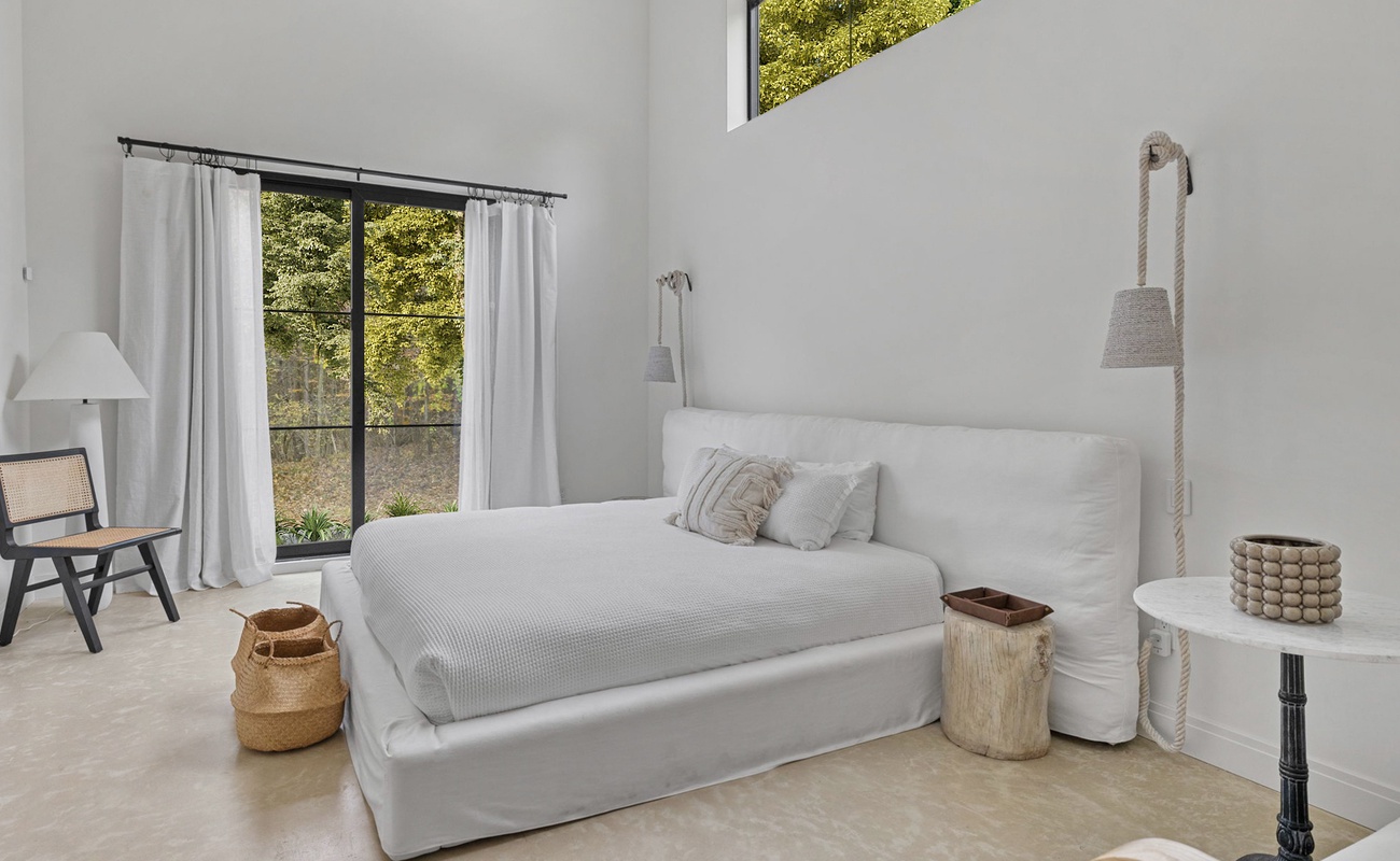 Primary bedroom has a king-size bed.