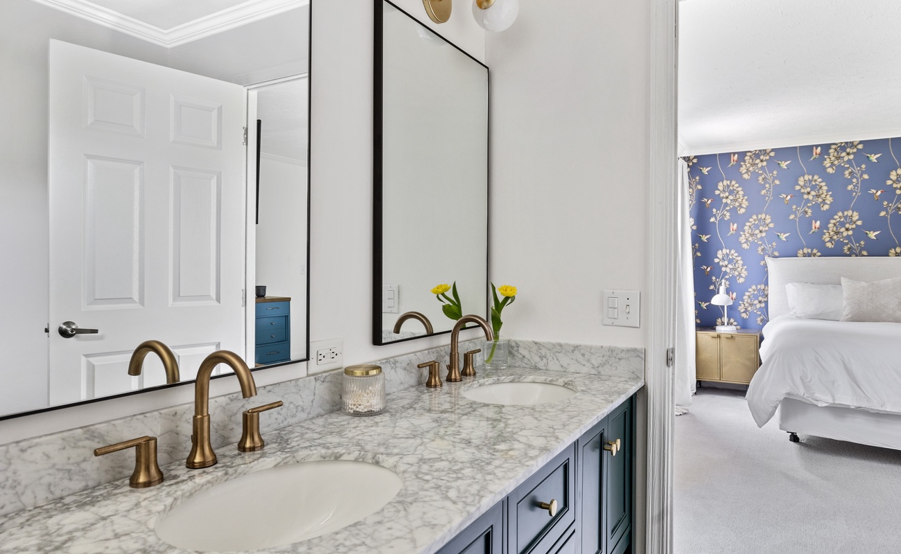 The en-suite bathroom offers a relaxing space to unwind after a day of vacation fun.