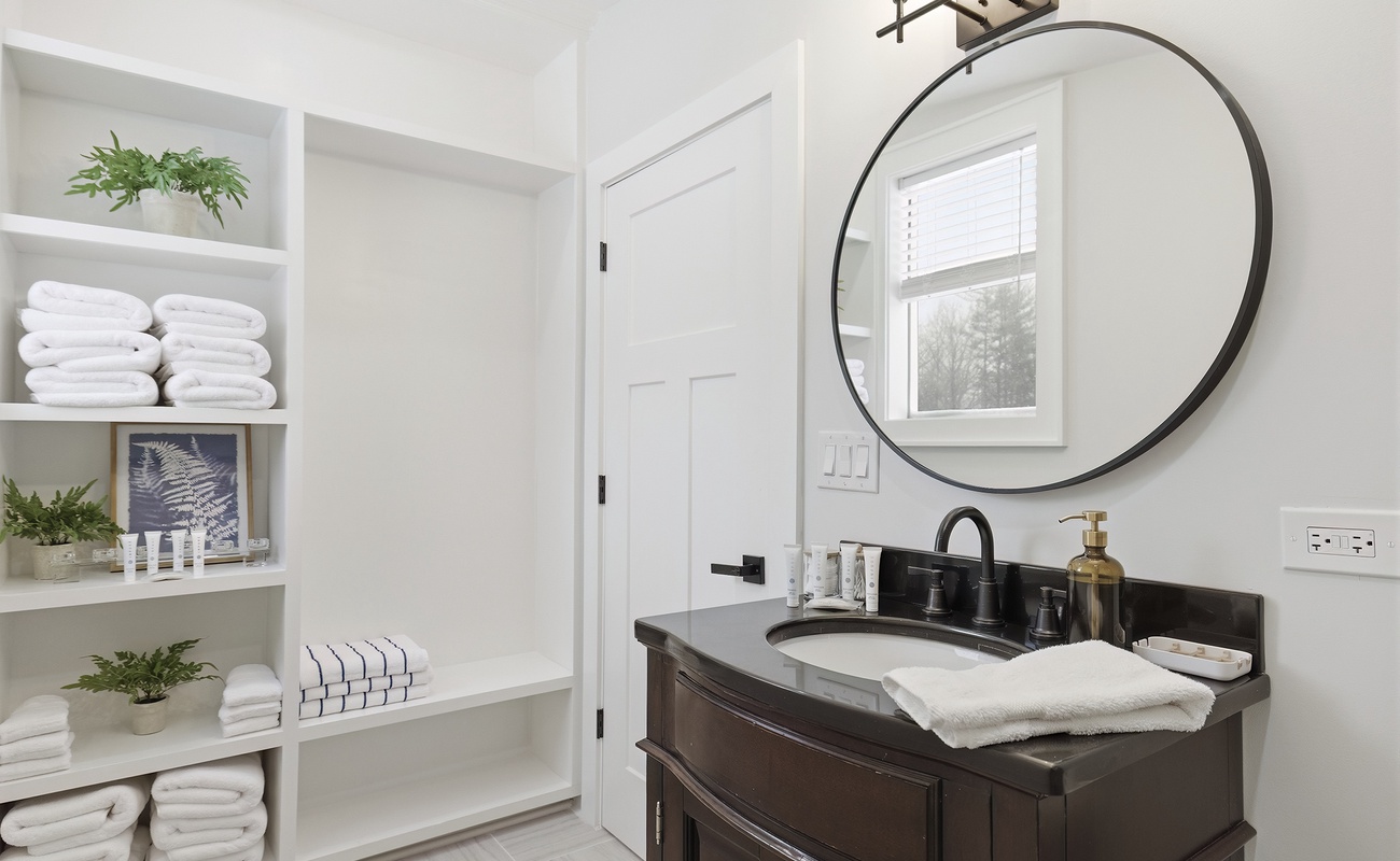 Bright and organized, this guest bath offers plenty of storage for your stay.
