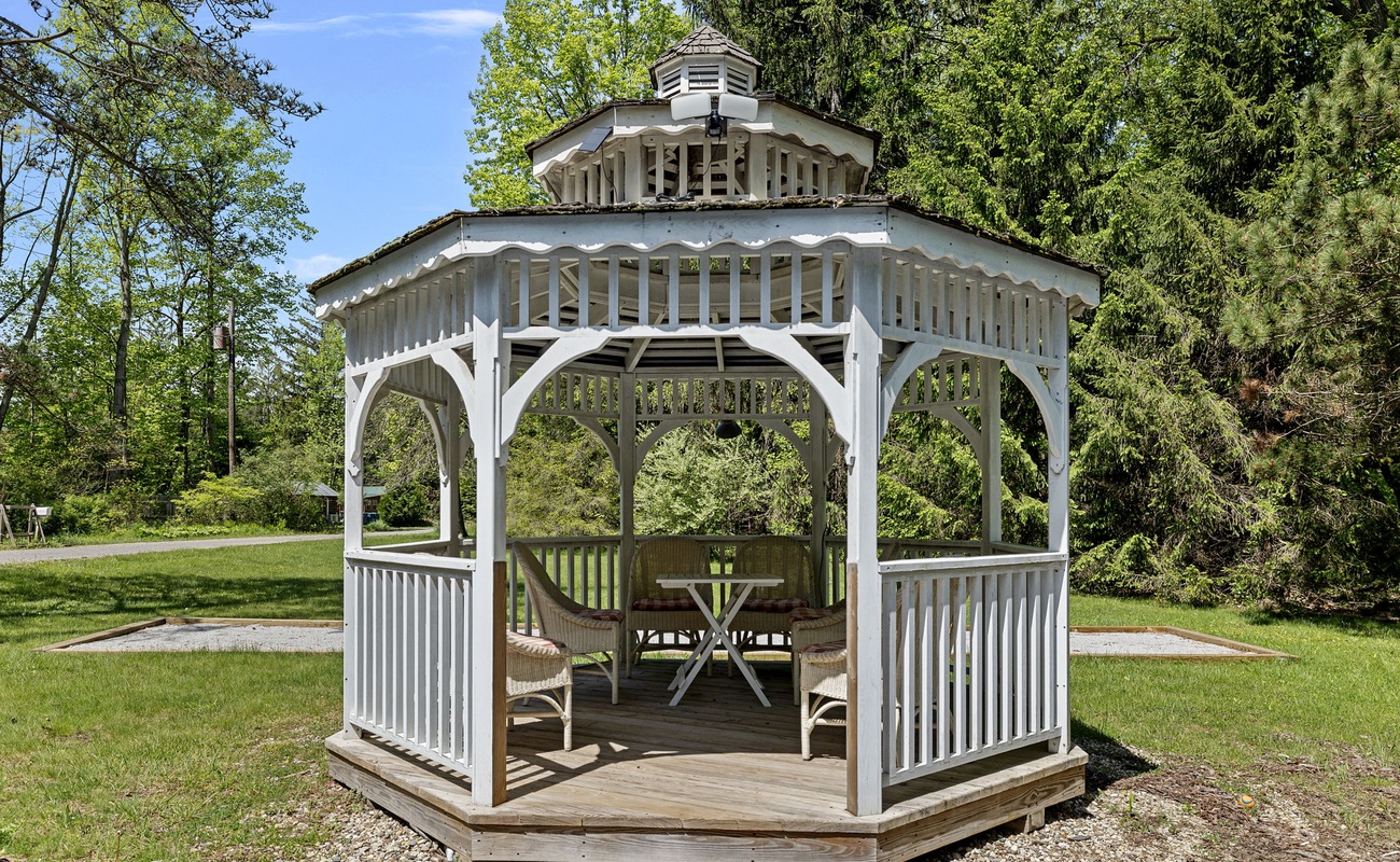 A coolio gazebo with 6 comfy chairs. Listening to bird-songs. Yep, life is good.