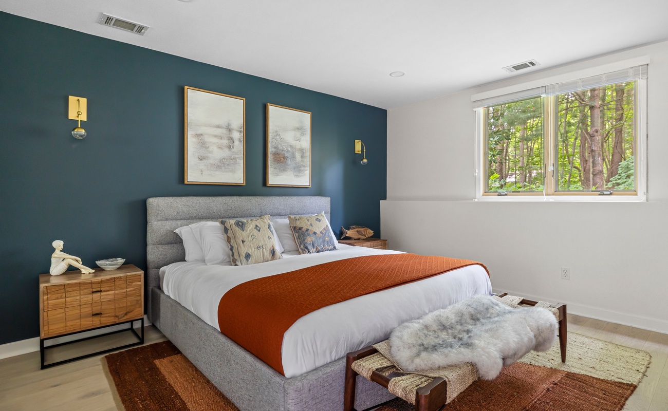 Primary bedroom is on the lower level & has a king-size bed.