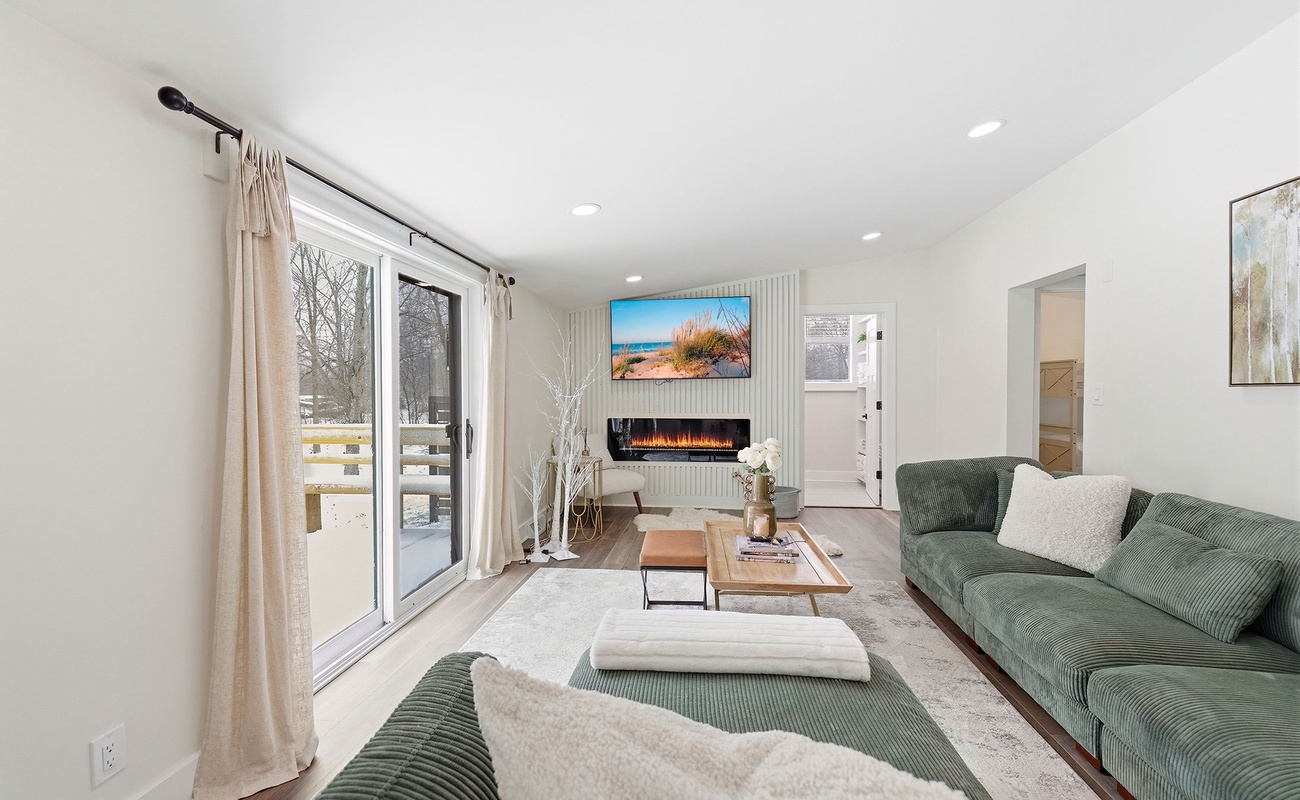 Sliding glass doors bring light and outdoor access to the living room.