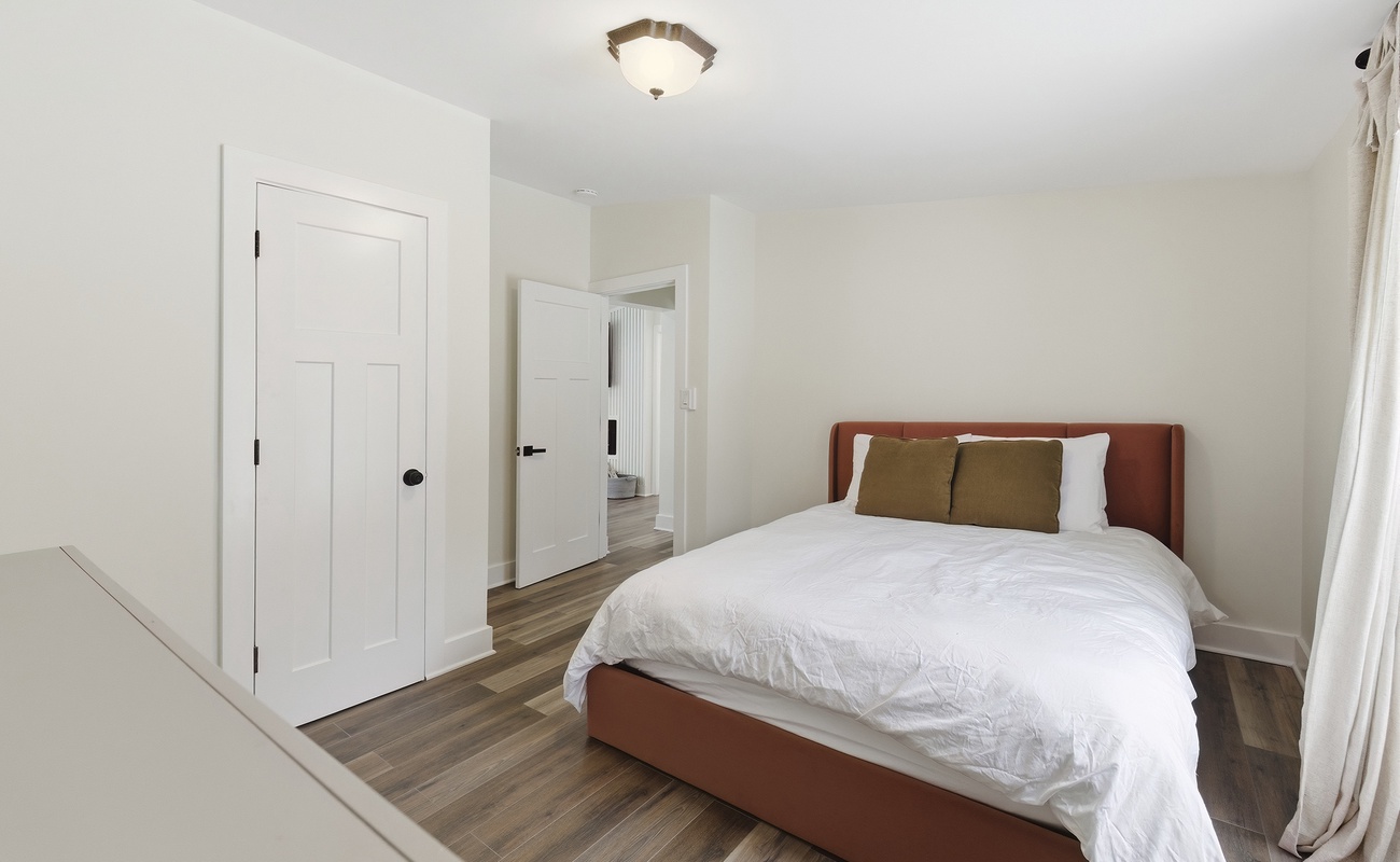 Bedroom 3 has a queen-sized bed