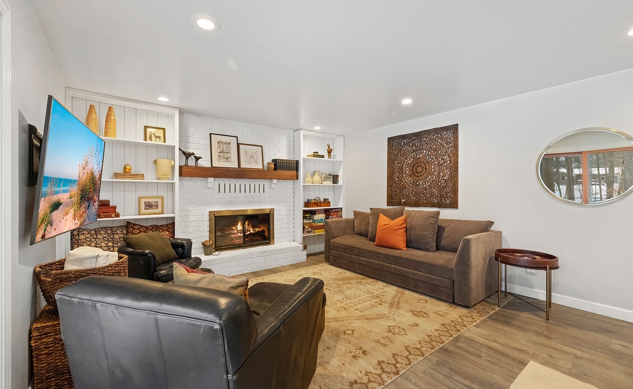 A fireside lounge with a pull-out sofa for flexible, easy stays.